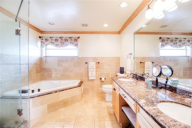 full bathroom with tile walls, vanity, ornamental molding, shower with separate bathtub, and toilet