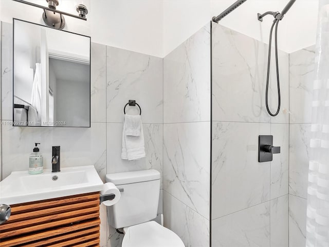 bathroom with vanity, a shower with curtain, toilet, and tile walls