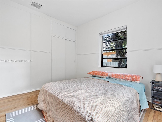 bedroom featuring a closet and wood-type flooring