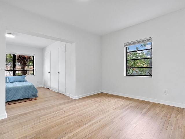 unfurnished bedroom featuring light hardwood / wood-style floors