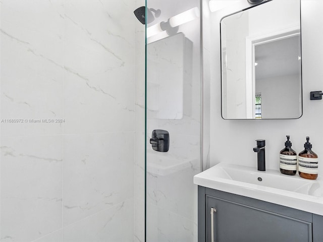 bathroom featuring vanity and a tile shower