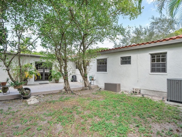 view of yard with a patio area and cooling unit