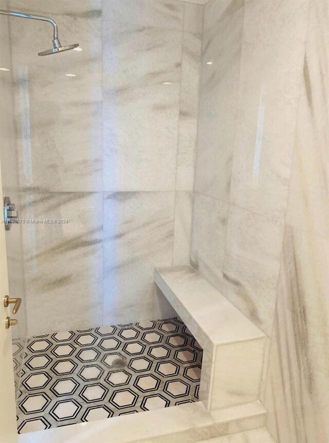 bathroom with tiled shower