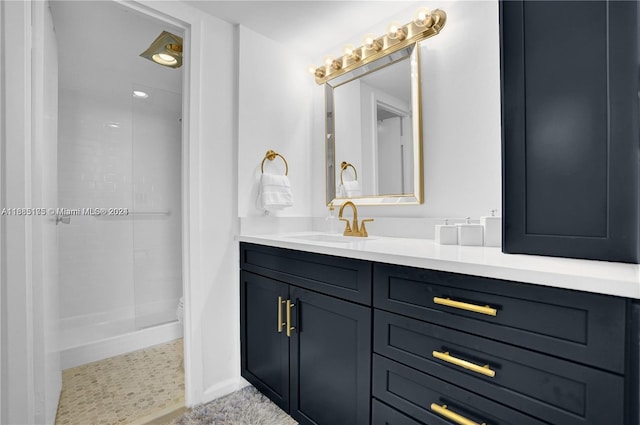 bathroom with vanity, tile patterned floors, and a shower