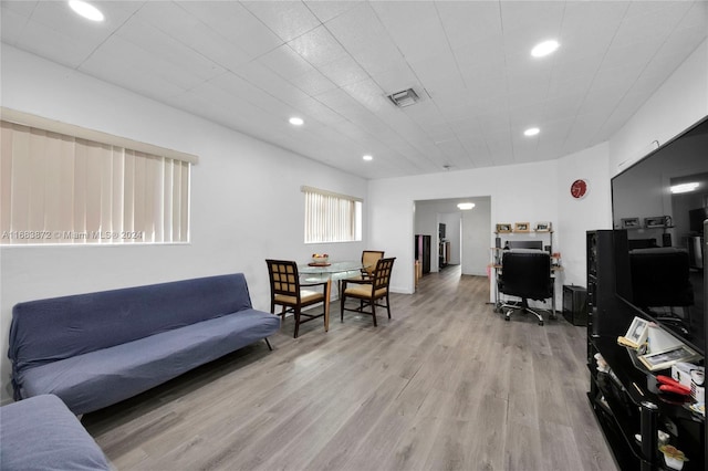 living room with light hardwood / wood-style flooring