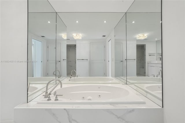 bathroom featuring a relaxing tiled tub