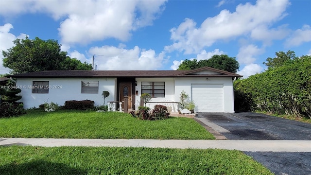 ranch-style home featuring a garage and a front yard