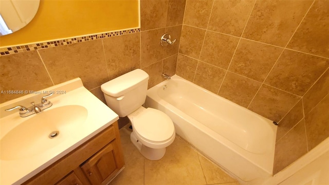 bathroom featuring tile patterned floors, vanity, tile walls, and toilet