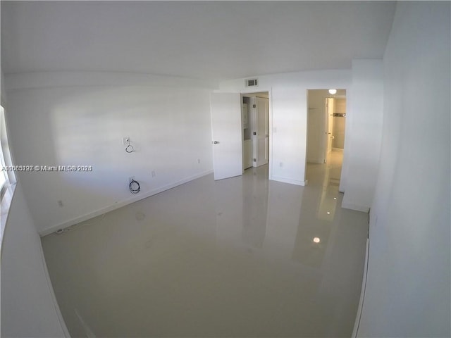 spare room with concrete floors