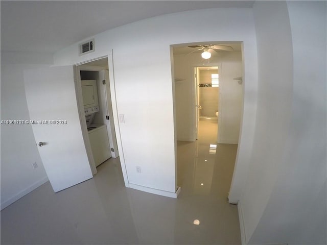 9367 Fontainebleau Blvd Unit G120, Miami, FL 33172 - unfurnished room featuring stacked washing machine and dryer, a ceiling fan, and baseboards