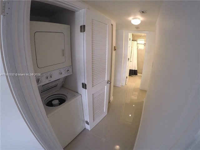 9367 Fontainebleau Blvd Unit G120, Miami, FL 33172 - washroom featuring stacked washer / dryer and tile patterned flooring
