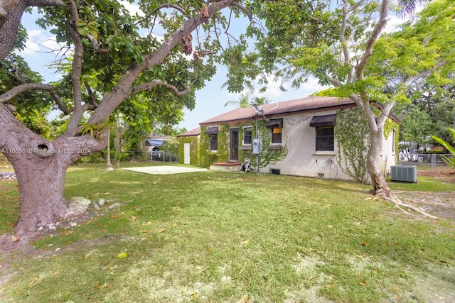 view of yard featuring a patio and central AC unit