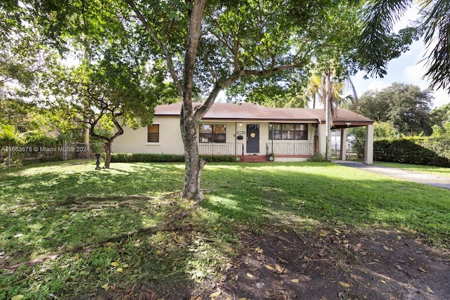 ranch-style home with covered porch and a front lawn