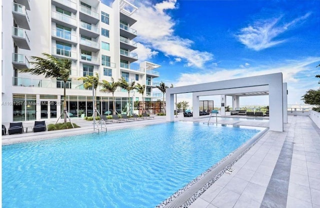 view of swimming pool featuring a patio