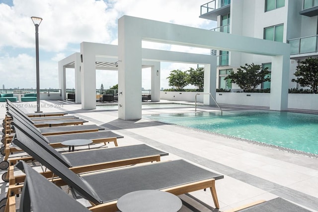 view of swimming pool with a patio