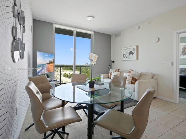 dining space featuring light tile patterned floors