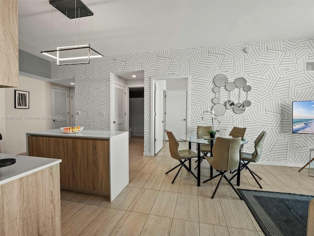 kitchen featuring decorative light fixtures and a kitchen island