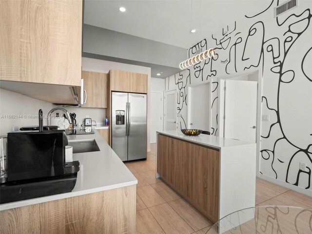 3900 Biscayne Blvd Unit N-1211, Miami, FL 33137 - kitchen featuring stainless steel fridge with ice dispenser, modern cabinets, a center island, light countertops, and brown cabinets