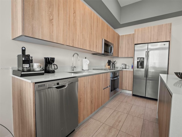 3900 Biscayne Blvd Unit N-1211, Miami, FL 33137 - kitchen with stainless steel appliances, a sink, modern cabinets, and light countertops