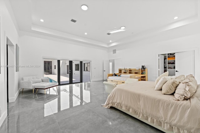 bedroom featuring access to exterior, a high ceiling, and french doors