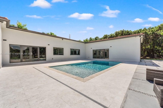 view of swimming pool featuring a patio