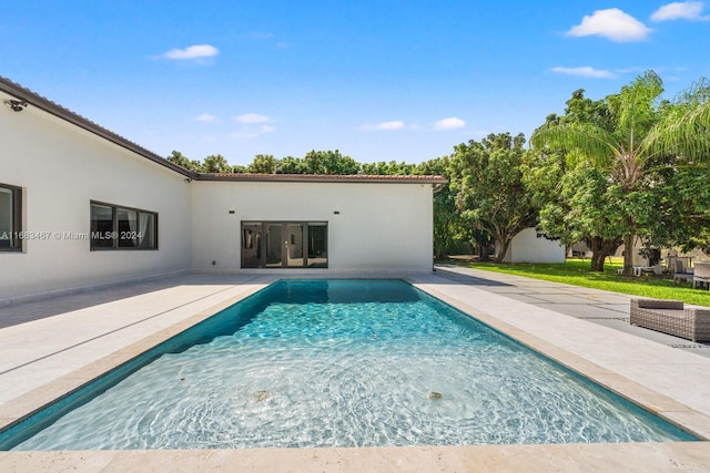 view of swimming pool with a patio area