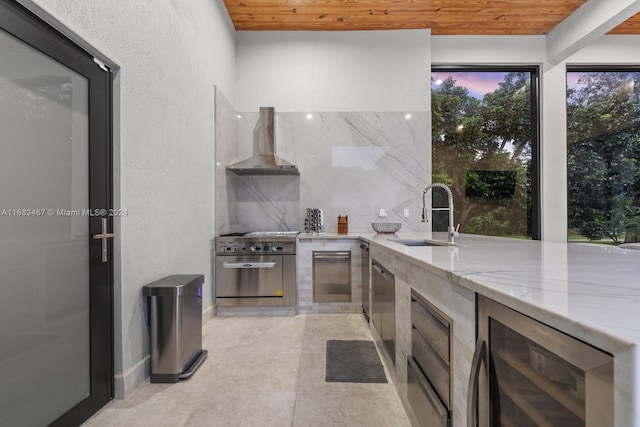 view of patio featuring an outdoor wet bar, beverage cooler, and exterior kitchen