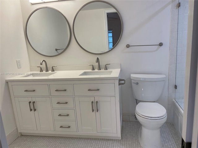 full bathroom featuring tile patterned floors, vanity, toilet, and enclosed tub / shower combo