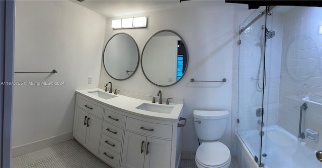 full bathroom with tile patterned flooring, vanity, toilet, and enclosed tub / shower combo