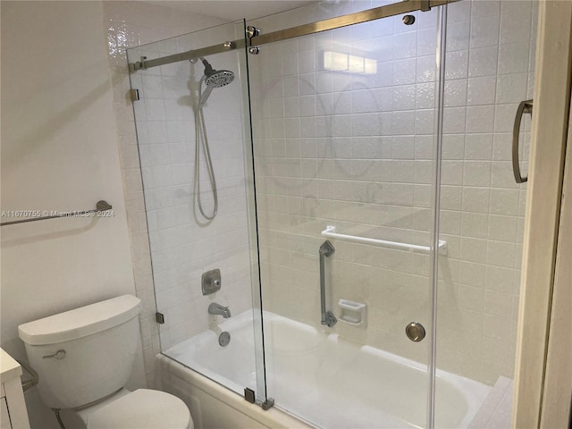 full bathroom with toilet, combined bath / shower with glass door, and vanity