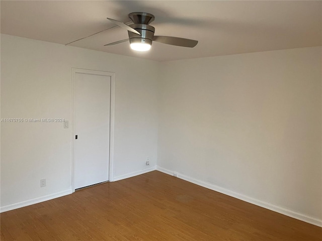 unfurnished room with hardwood / wood-style flooring and ceiling fan