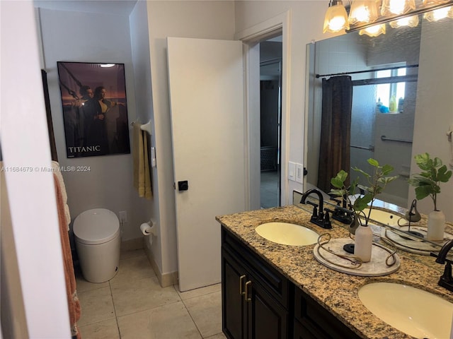 bathroom with tile patterned flooring, vanity, tiled shower, and toilet