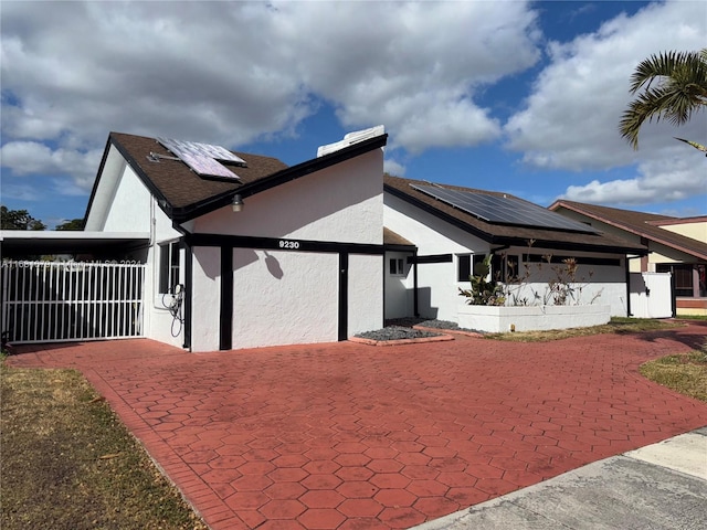 view of home's exterior with solar panels