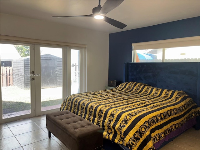 bedroom with tile patterned flooring, ceiling fan, access to exterior, and multiple windows