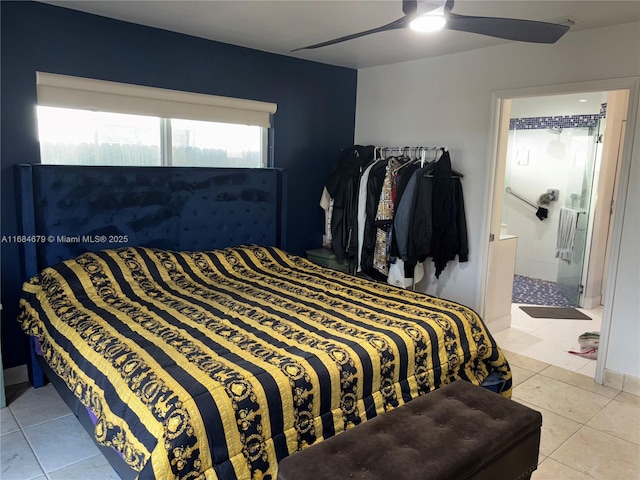 tiled bedroom with ensuite bathroom and a ceiling fan