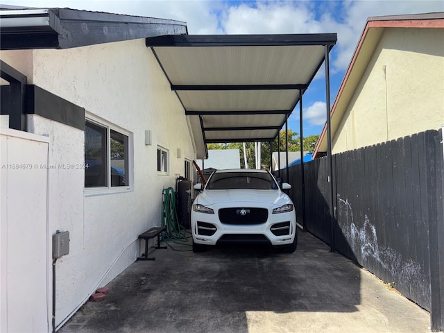 view of vehicle parking featuring a carport