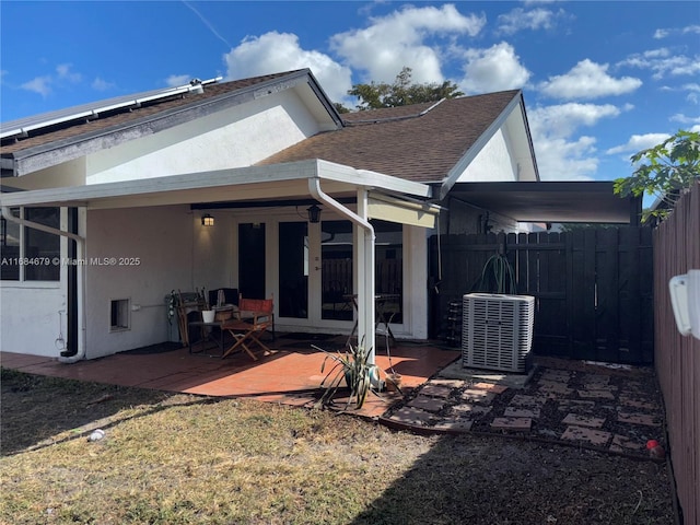 9230 SW 100th Ave Rd, Miami, FL 33176 - back of house with french doors, central AC unit, a patio, fence, and stucco siding