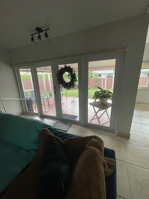 9230 SW 100th Ave Rd, Miami, FL 33176 - living room with light tile patterned floors and healthy amount of natural light