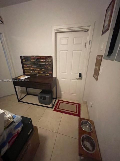 hallway with light tile patterned flooring