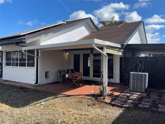 9230 SW 100th Ave Rd, Miami, FL 33176 - rear view of property featuring french doors, fence, central AC unit, and stucco siding