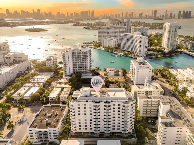 aerial view at dusk with a water view