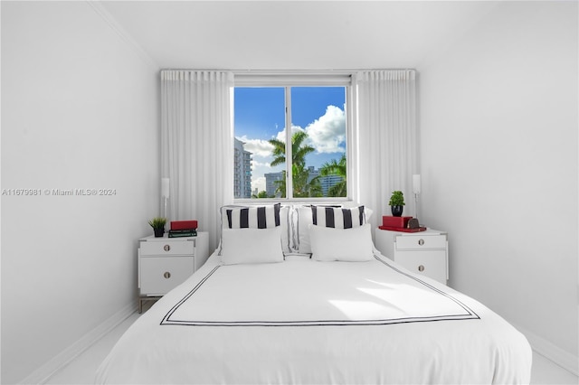 bedroom featuring crown molding