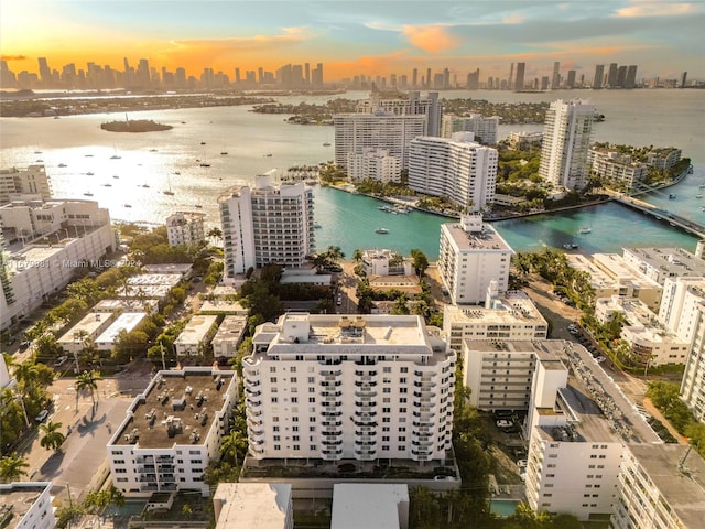 aerial view at dusk with a water view