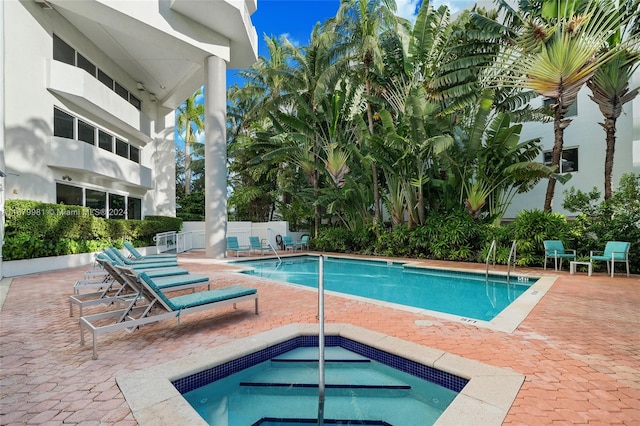 view of swimming pool featuring a patio area