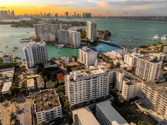 aerial view at dusk with a water view