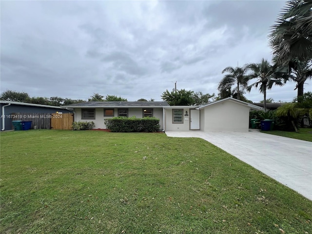 ranch-style home with a front lawn