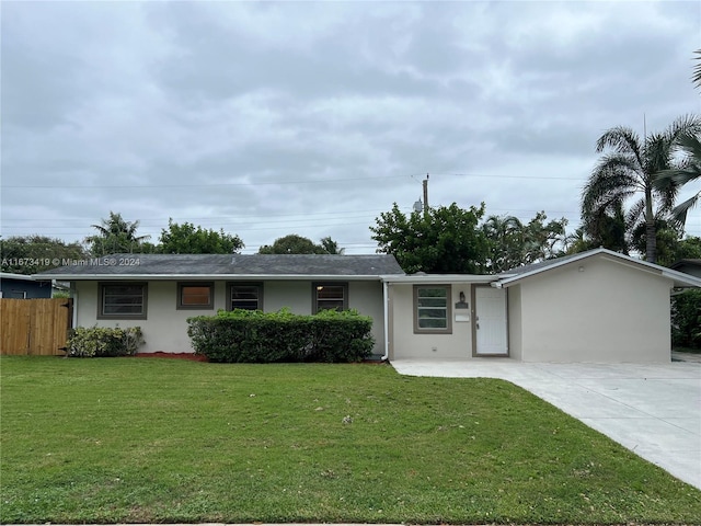 ranch-style house with a front yard