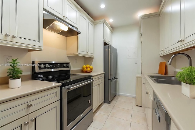 kitchen featuring sink, light tile patterned floors, and stainless steel appliances