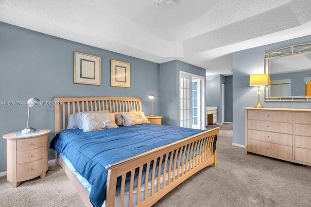 carpeted bedroom with a textured ceiling