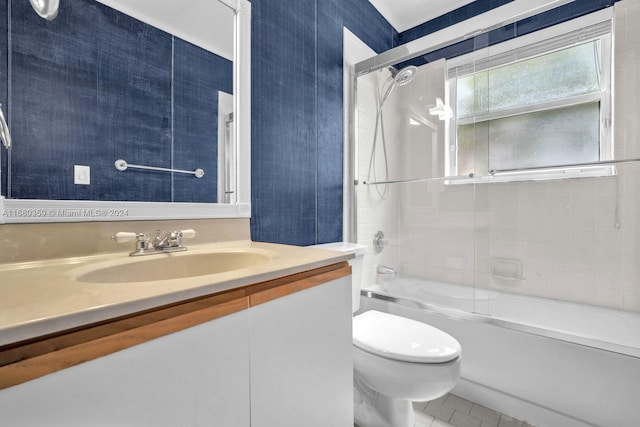 full bathroom with vanity, toilet, tiled shower / bath combo, and tile patterned flooring